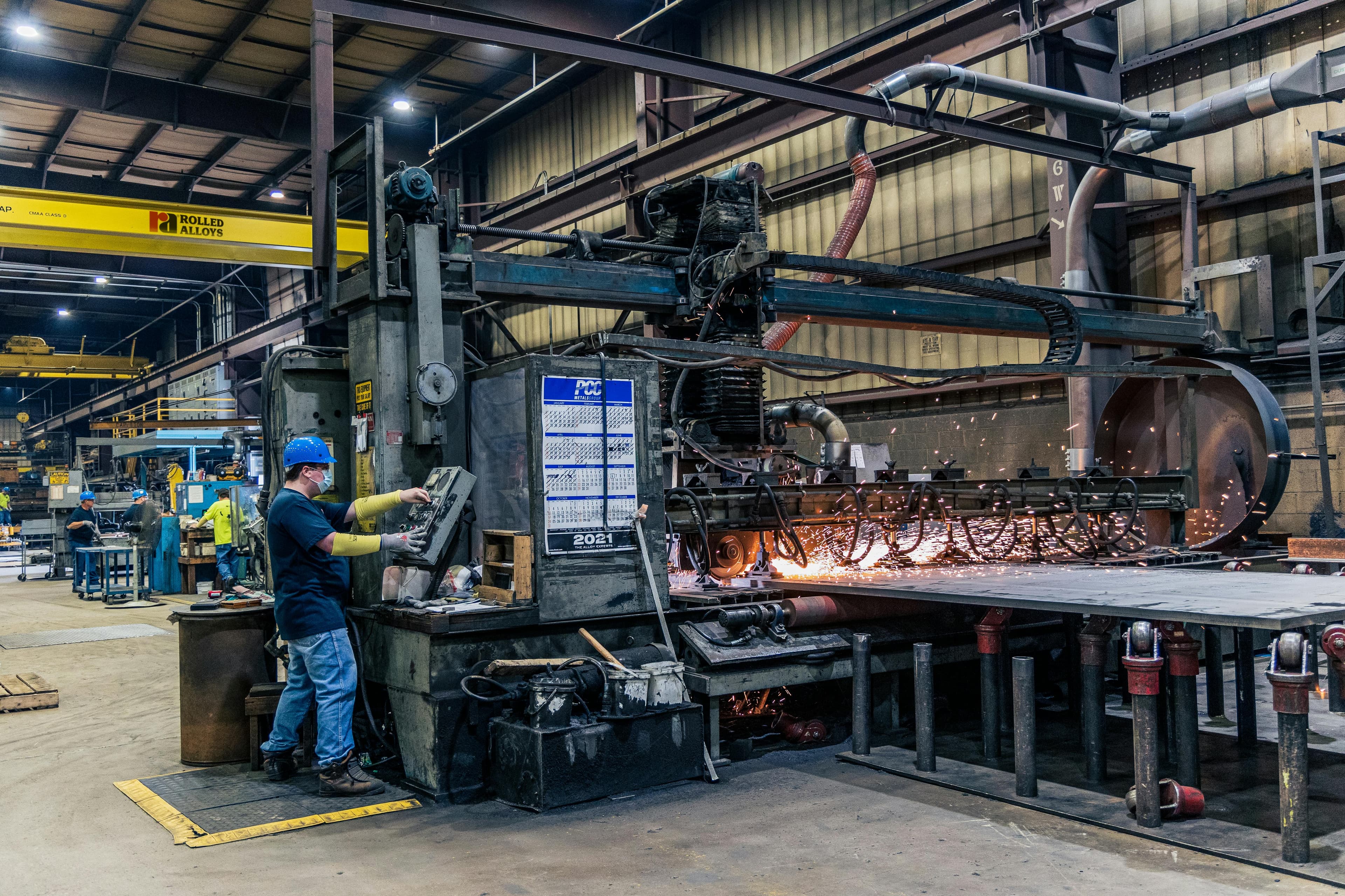 Industrial maintenance worker inspecting factory machinery and equipment